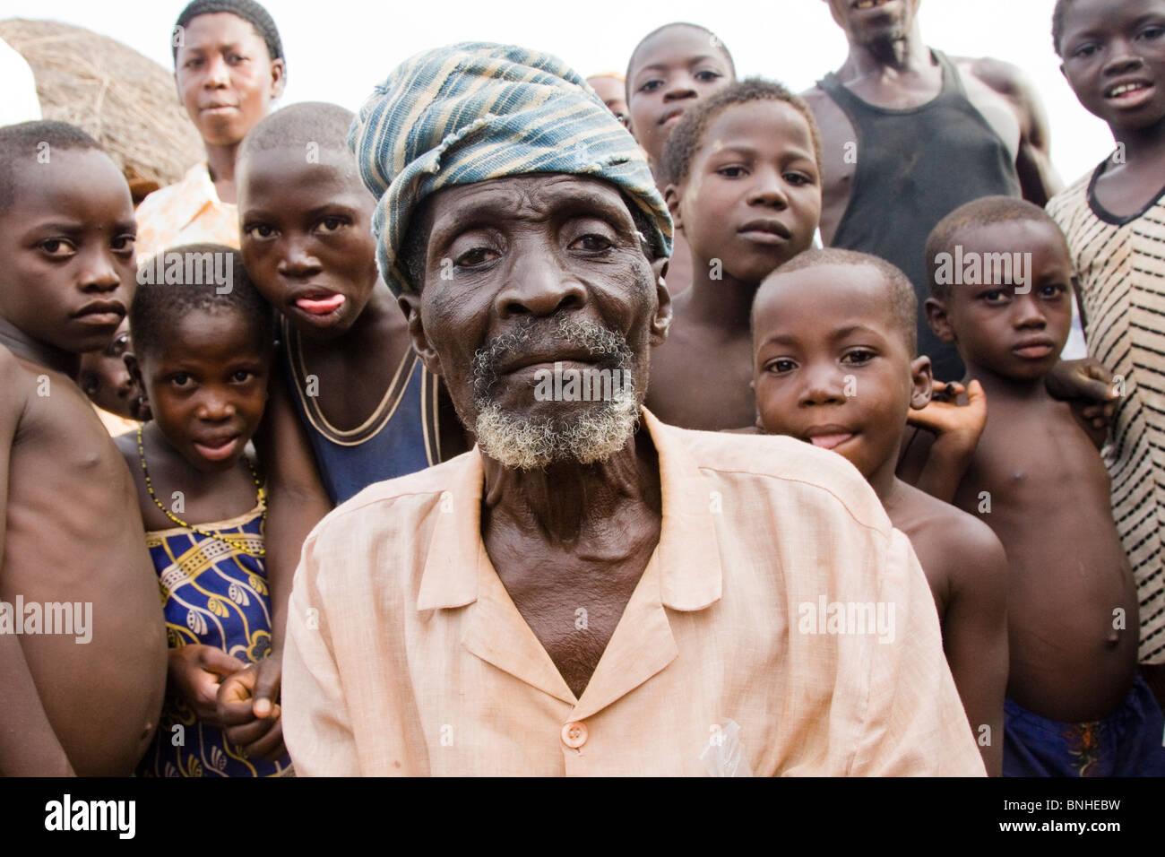 The chief of Bouchipe, a village in the Gonja Triangle, Damango district, with some of the children of the village. Stock Photo