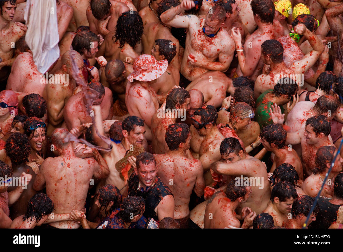 Spain August 2008 Valencia Region Bunol city Tomatina Festival Tomato tomatoes food fight crowds crowd people tourism event fun Stock Photo