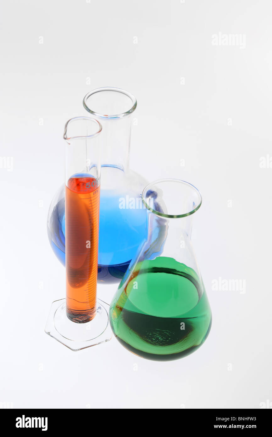 Flask, cylinder and backer with multicolored liquid Stock Photo - Alamy