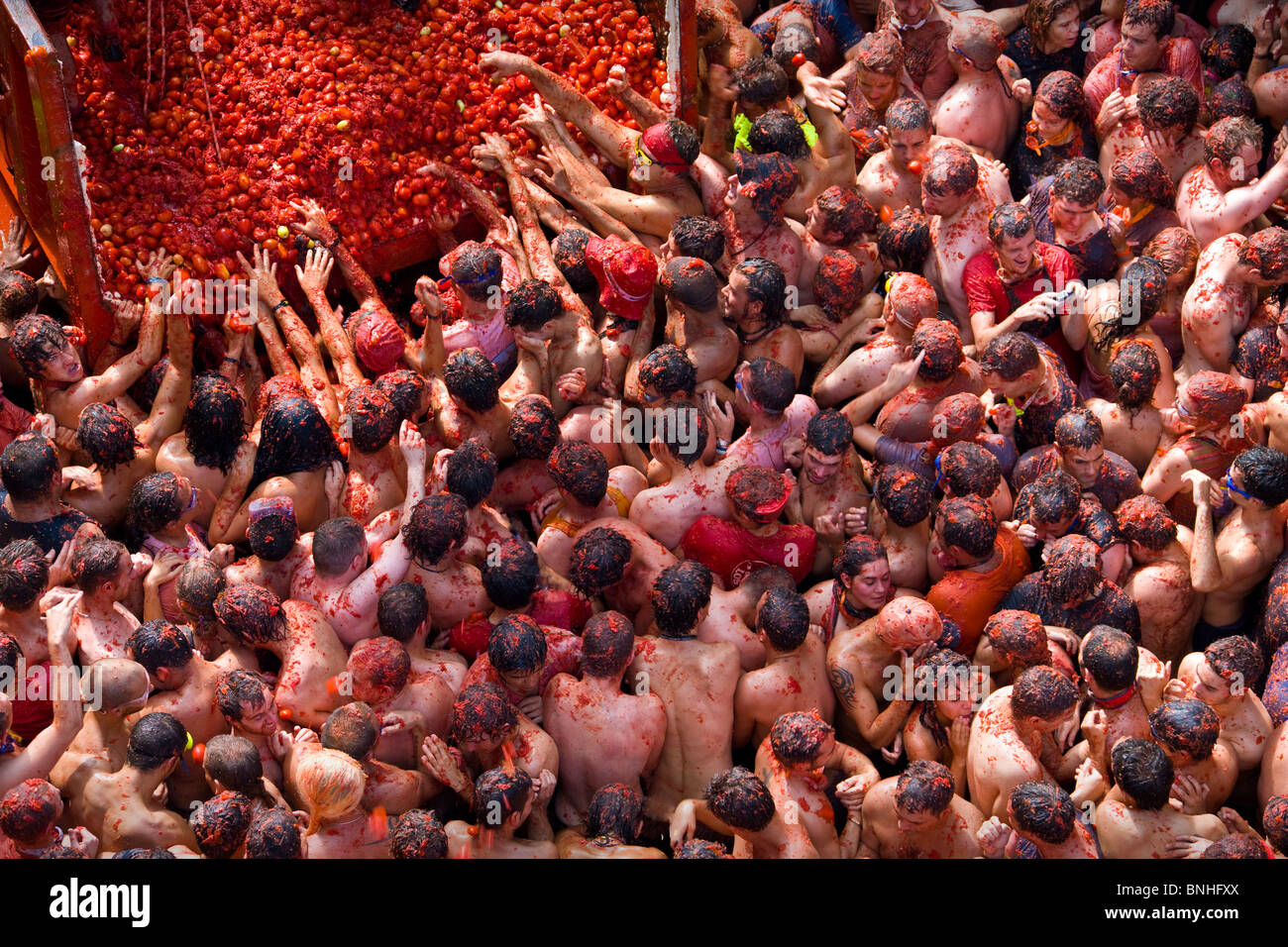 Spain August 2008 Valencia Region Bunol city Tomatina Festival Tomato tomatoes food fight crowds crowd people tourism event fun Stock Photo