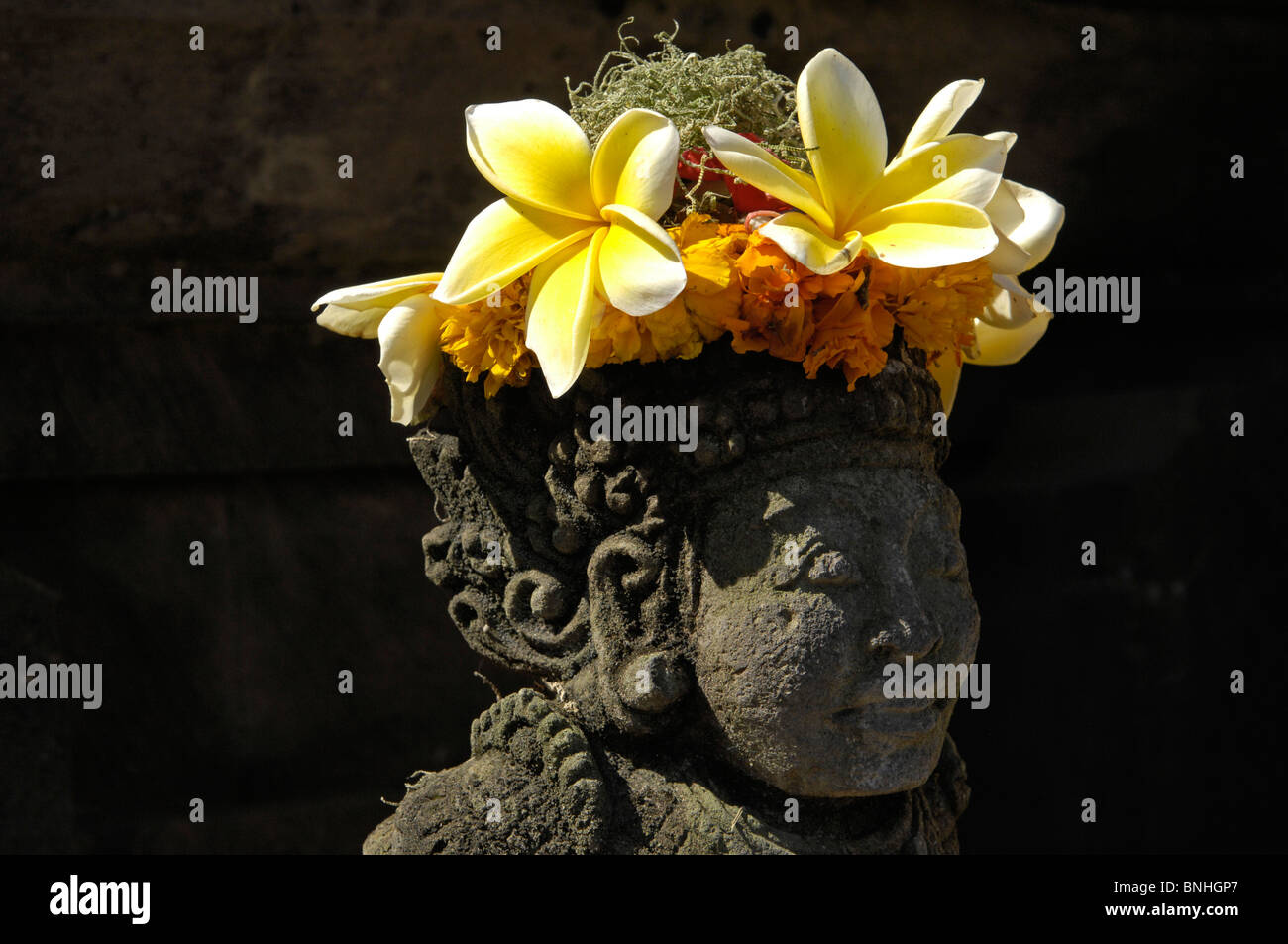 Bali Asia Indonesia travel Location Candi Dasa statue flowers figure decoration floral decorated Stock Photo