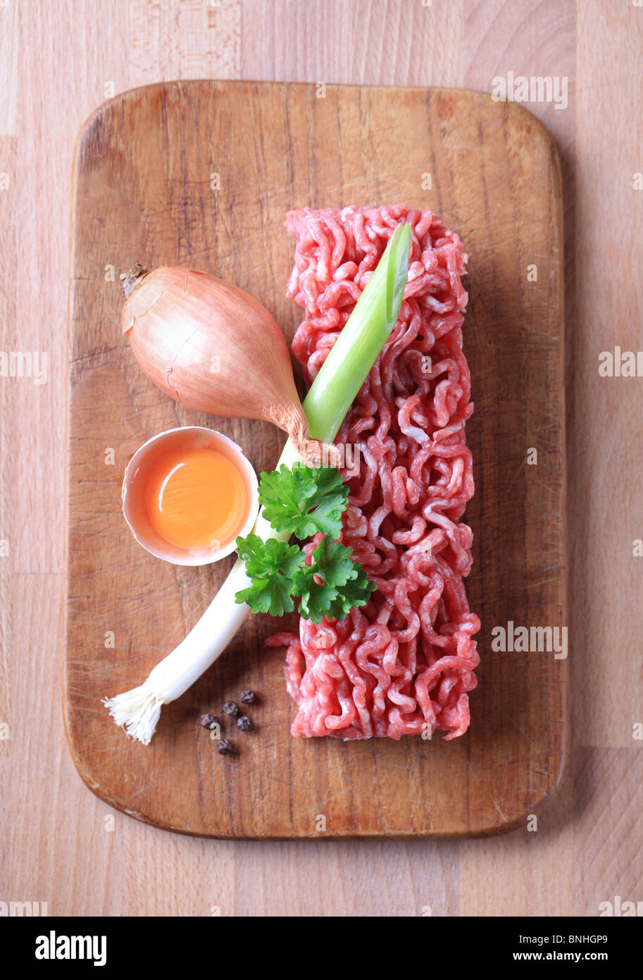 Raw minced meat and other ingredients - overhead Stock Photo