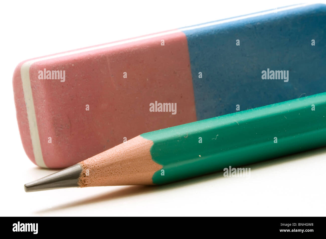 A green pencil and an eraser ink and graphite Stock Photo Alamy