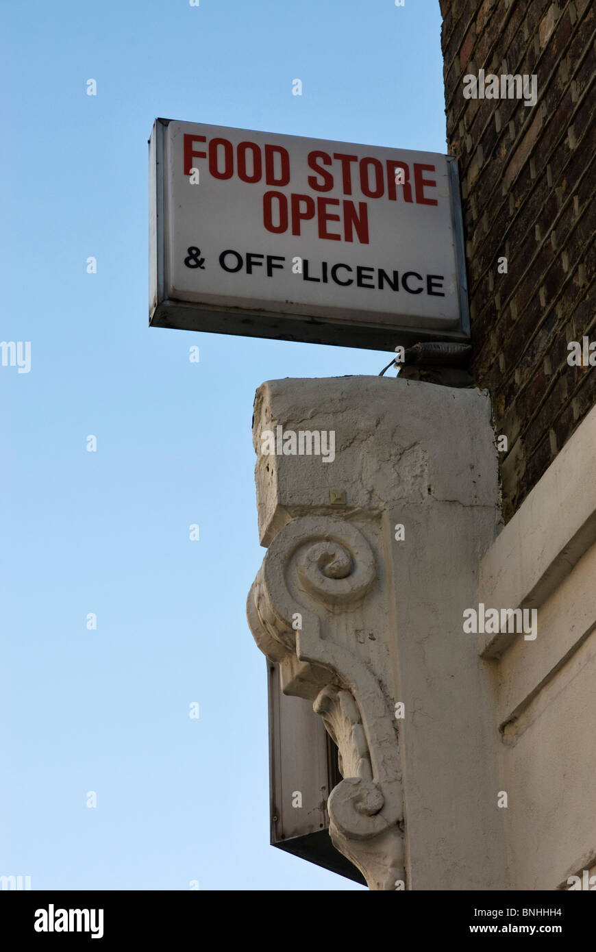 Food store open sign and off licence Stock Photo