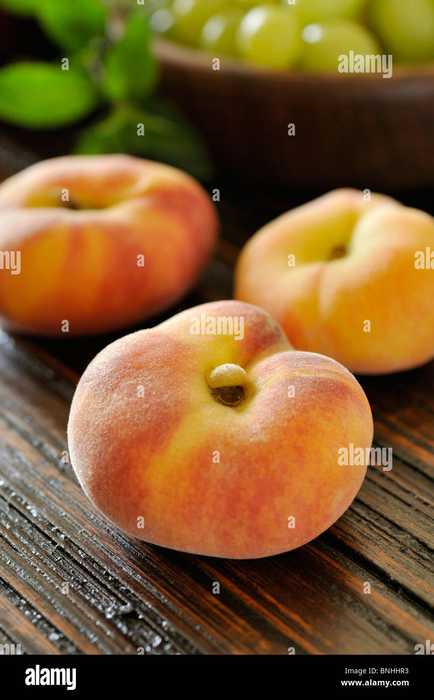 Flat peach (Prunus persica var. platycarpa) Stock Photo
