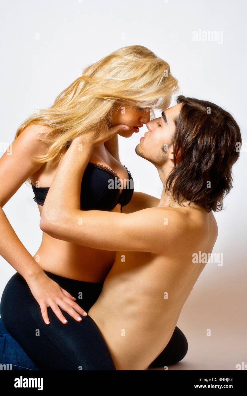Young Couple 20-25 years Adult Adults Blond Bond Bonding Care Caucasian Color Desire Flirt Flirty Heterosexual Indoor Indoors Stock Photo