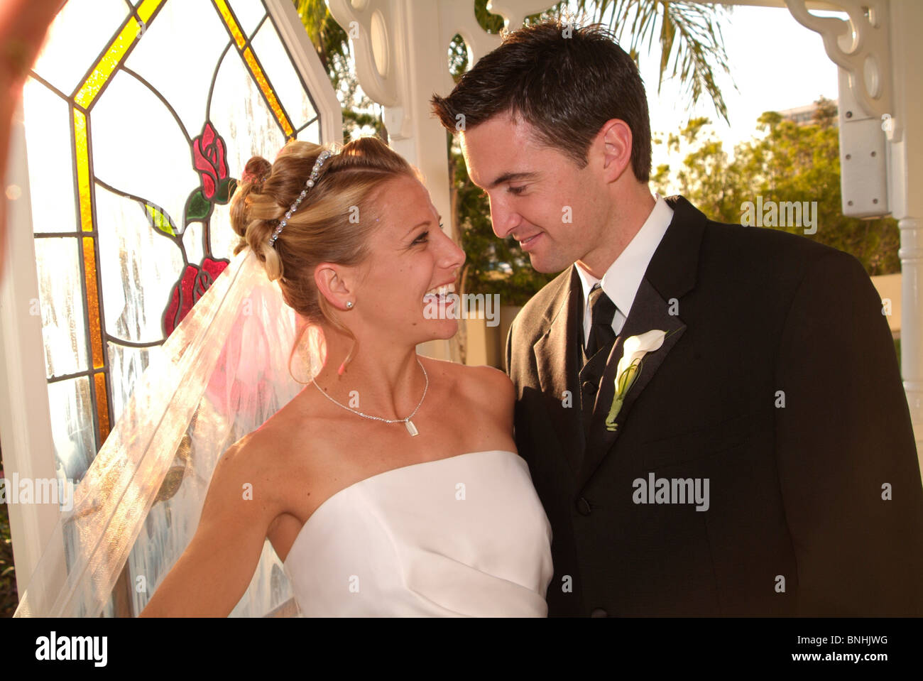 Bride and groom smiling at each other Stock Photo - Alamy