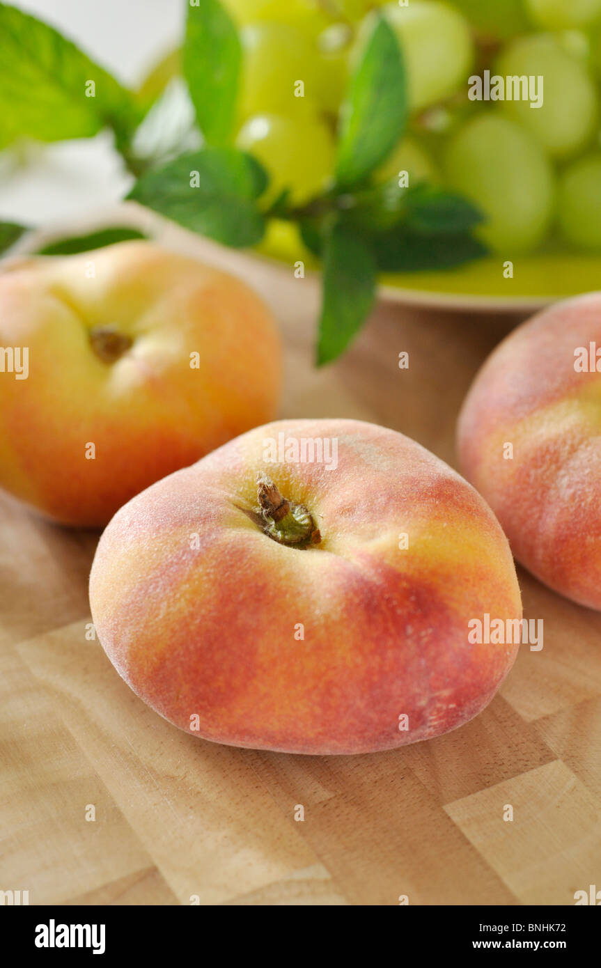 Flat peach (Prunus persica var. platycarpa) Stock Photo