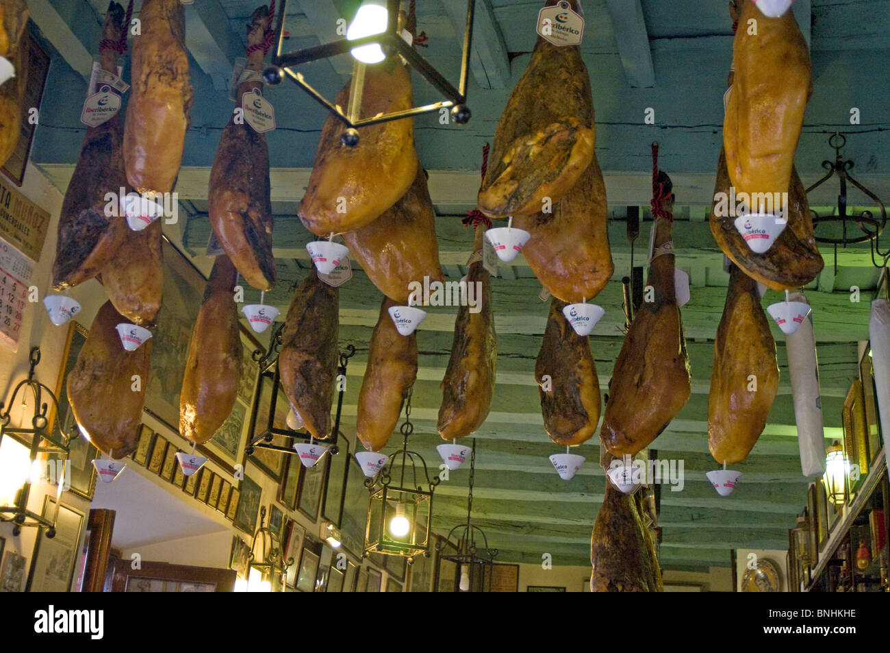 Spanish dry cured hams hanging up in a shop in Seville, Andalucia