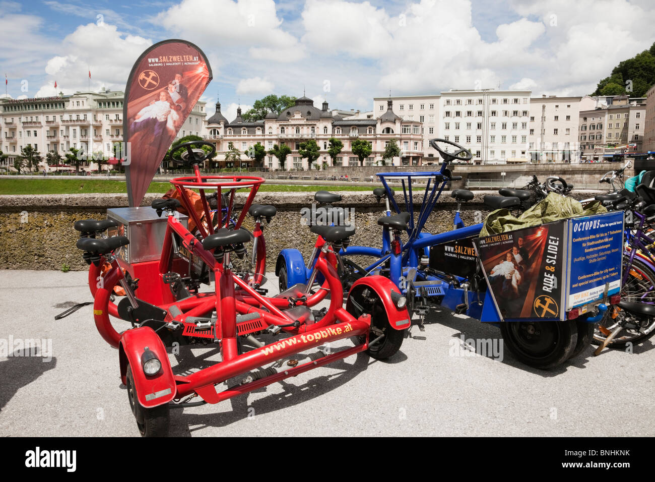 Salzburg, Austria, Europe. Octopus Conference bike and bicycles for hire by Salzach River Stock Photo