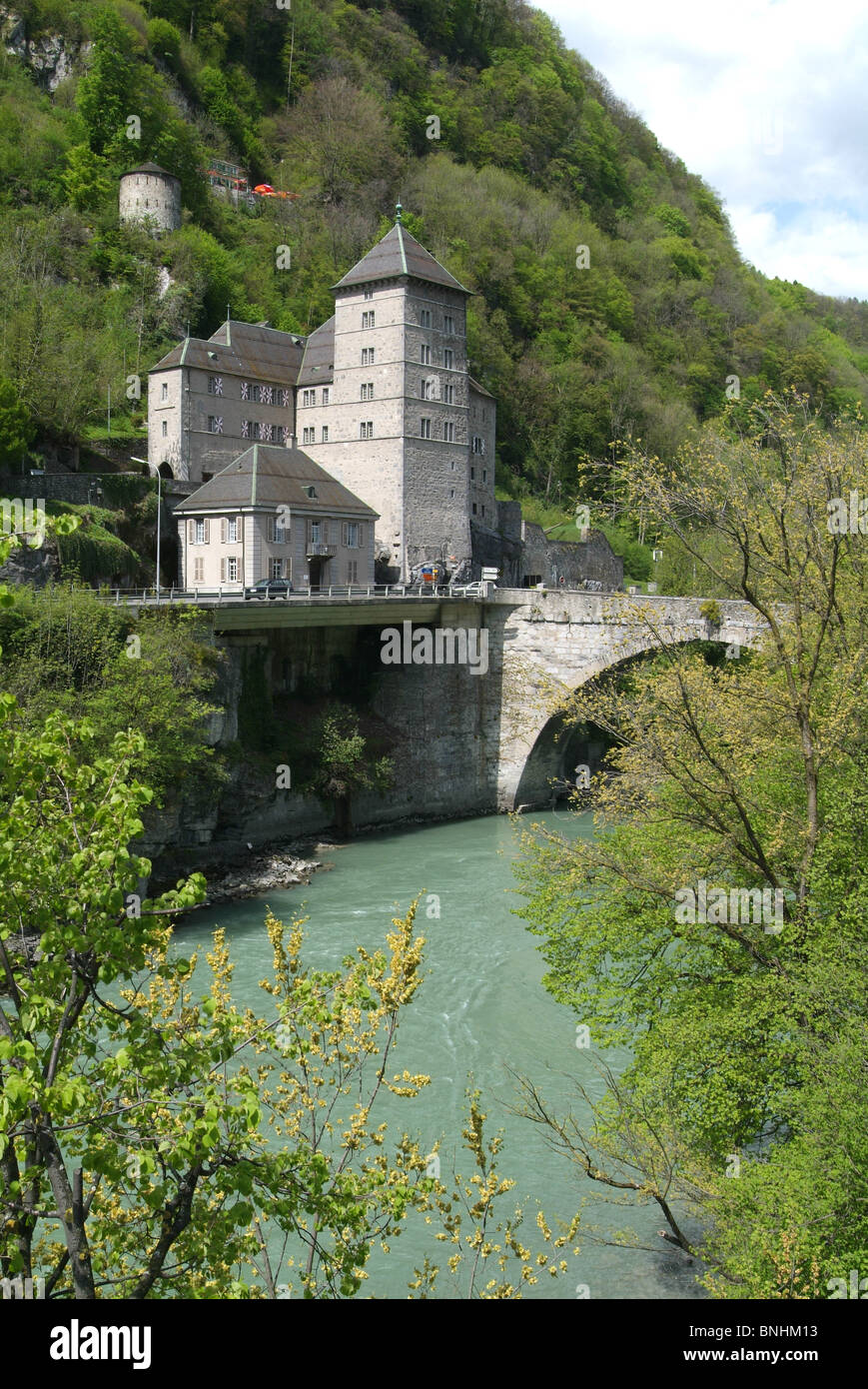 Switzerland Saint-Maurice Canton of Valais Dufour castle and tower historic river bridge mountain mountains alps Stock Photo