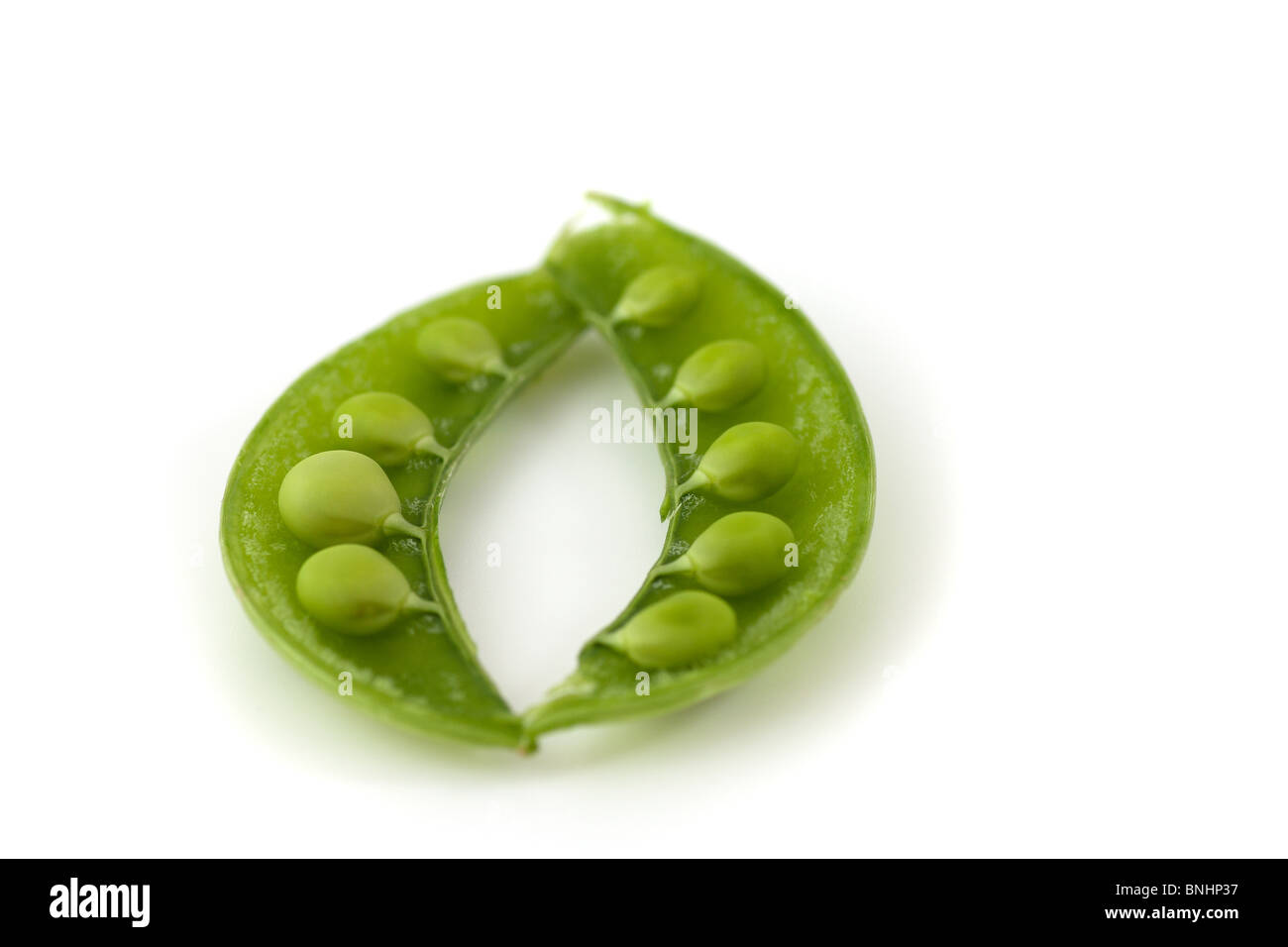 Peas in a pod on a white background Stock Photo