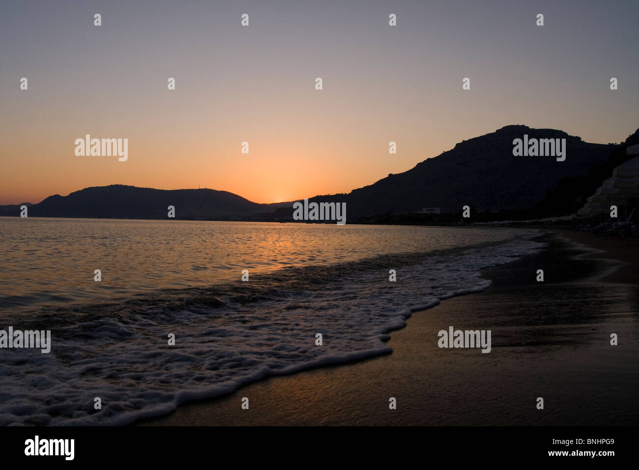Sunset at Pefkos Beach, Rhodes, Greece. Stock Photo