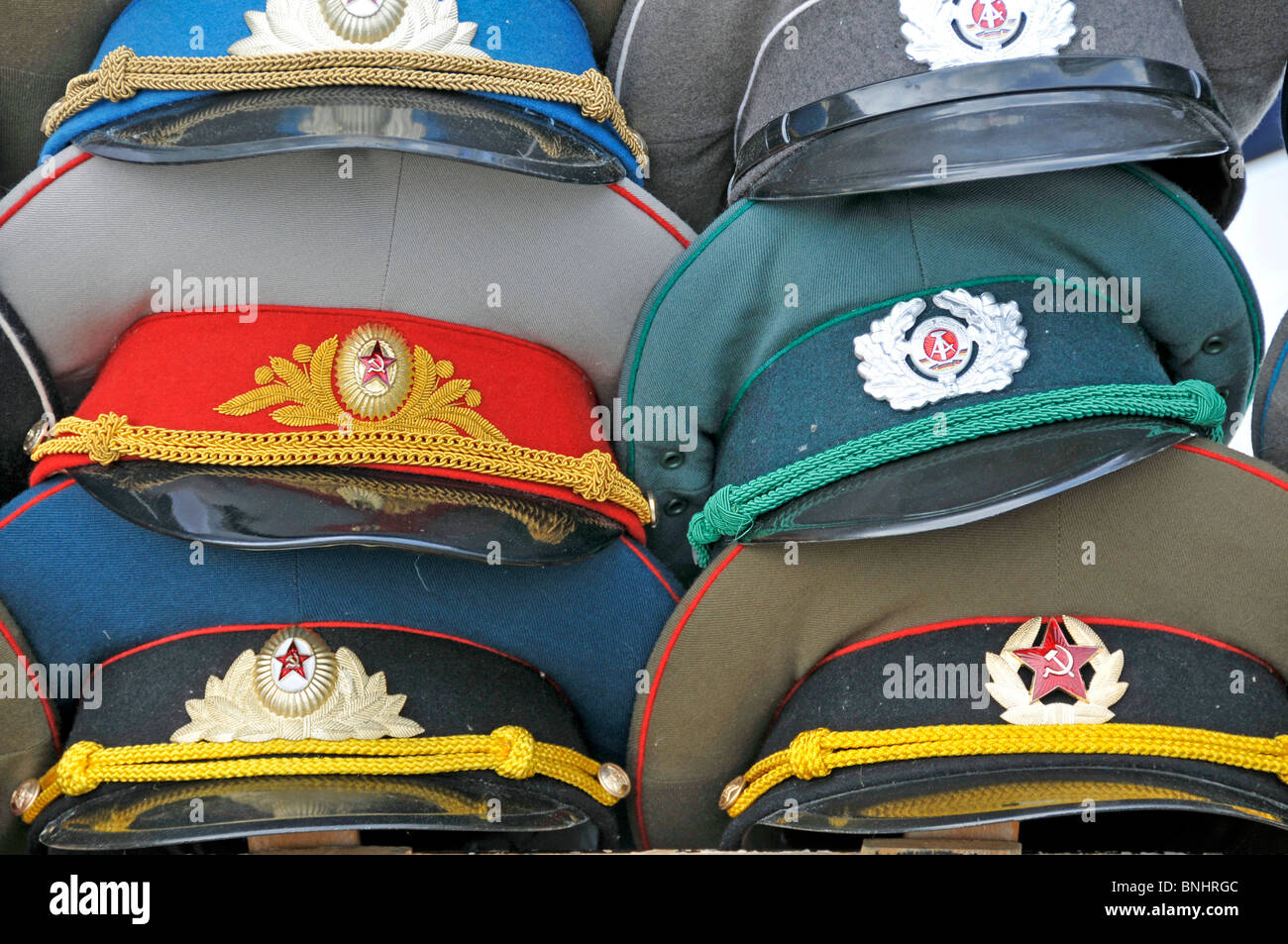 Peaked cap Caps Soviet DDR GDR Military Nostalgia Army Uniform Uniforms Souvenirs Checkpoint Charlie Berlin city Germany Europe Stock Photo