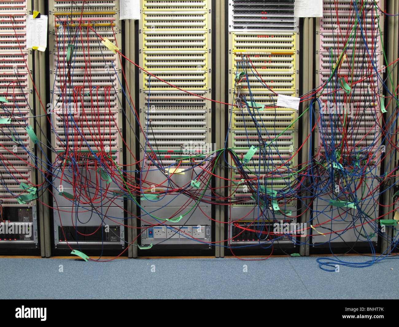 Low of computer servers with many coloured leads Stock Photo