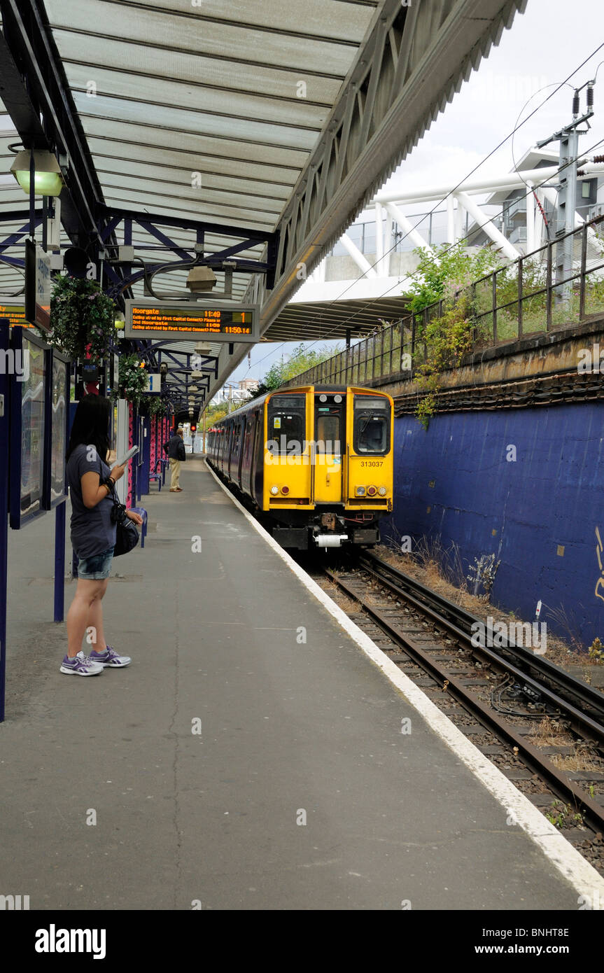 Drayton Park Station with train on the line Highbury London