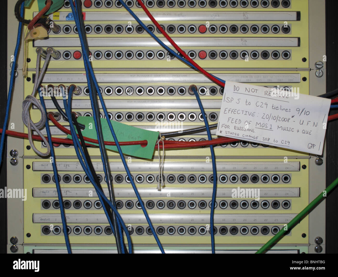 close up of wires coming from rack mounted servers Stock Photo