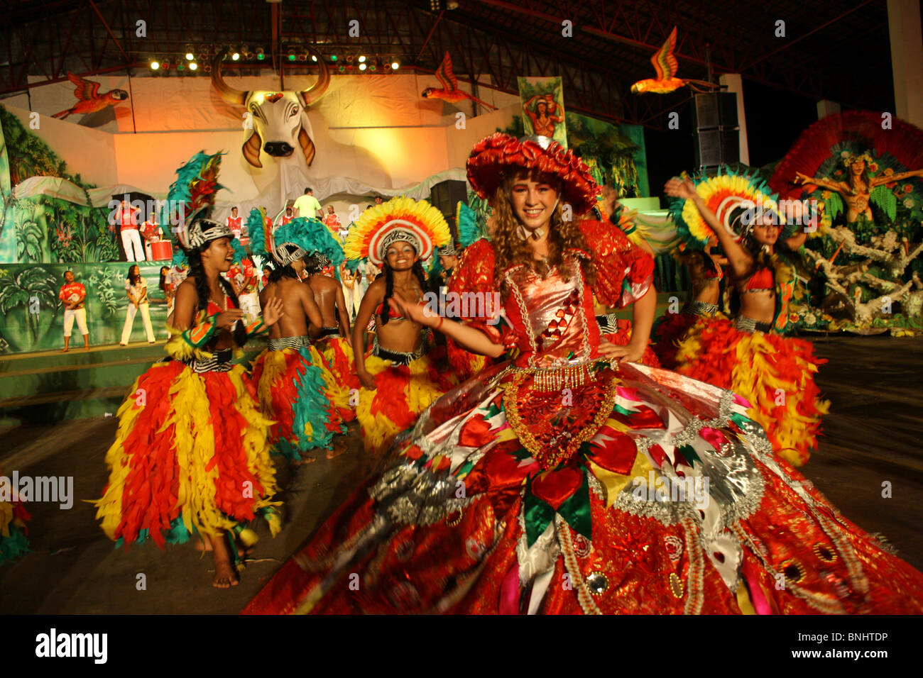 Parintins city Brazil Samba Show Boi Amazon basin Amazonia tropics tropical group women woman costumes Stock Photo - Alamy