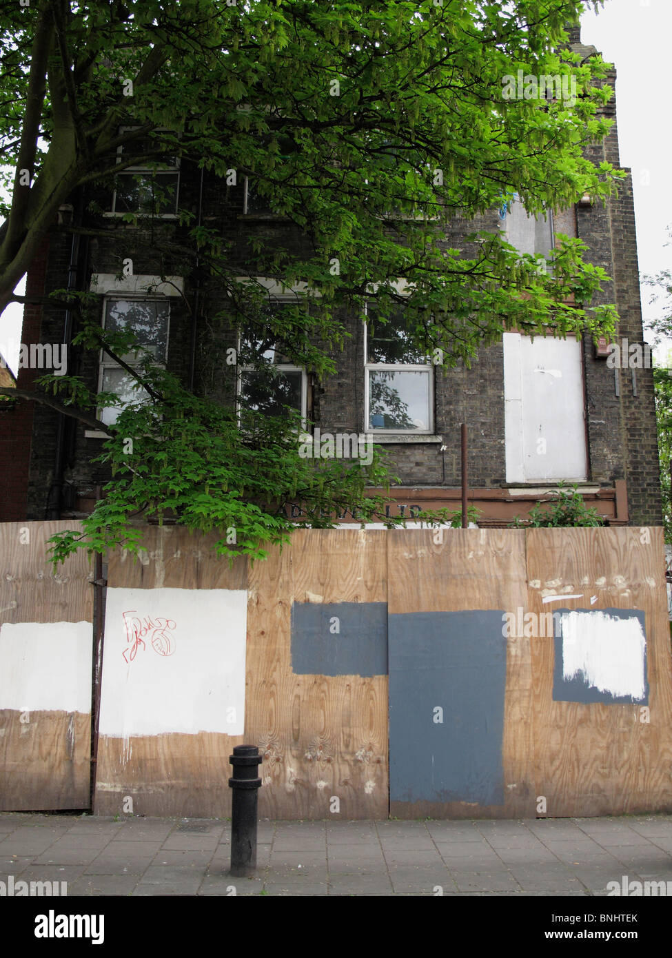 Boarded up abandoned building Stock Photo