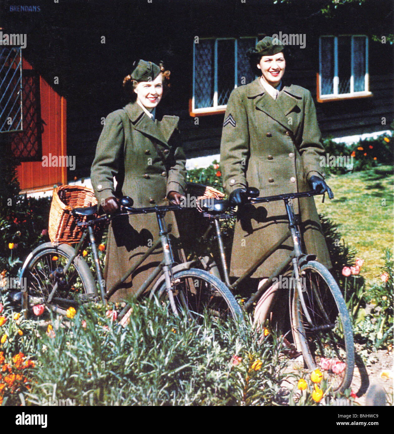 World War II Women’s Army Corps WAC US Army in England Great Britain Allied forces bicycles bikes women two woman uniform June Stock Photo