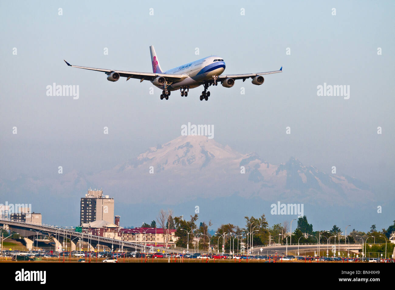 A China Airlines Airbus A340 (A340-313X) on final approach for landing at Vancouver International Airport. Stock Photo