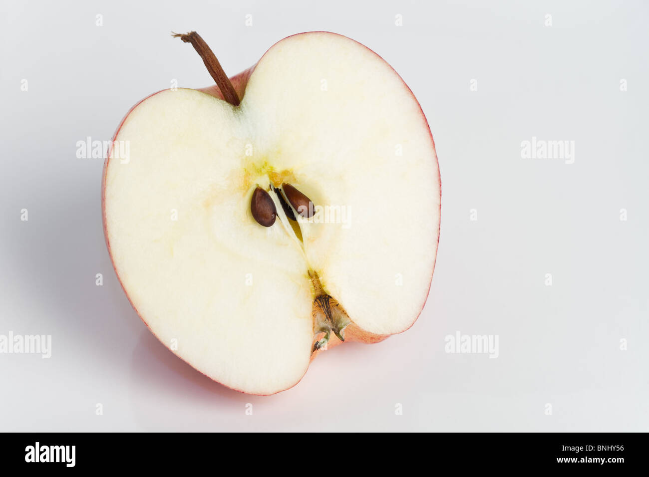 red apple cut in half Stock Photo - Alamy
