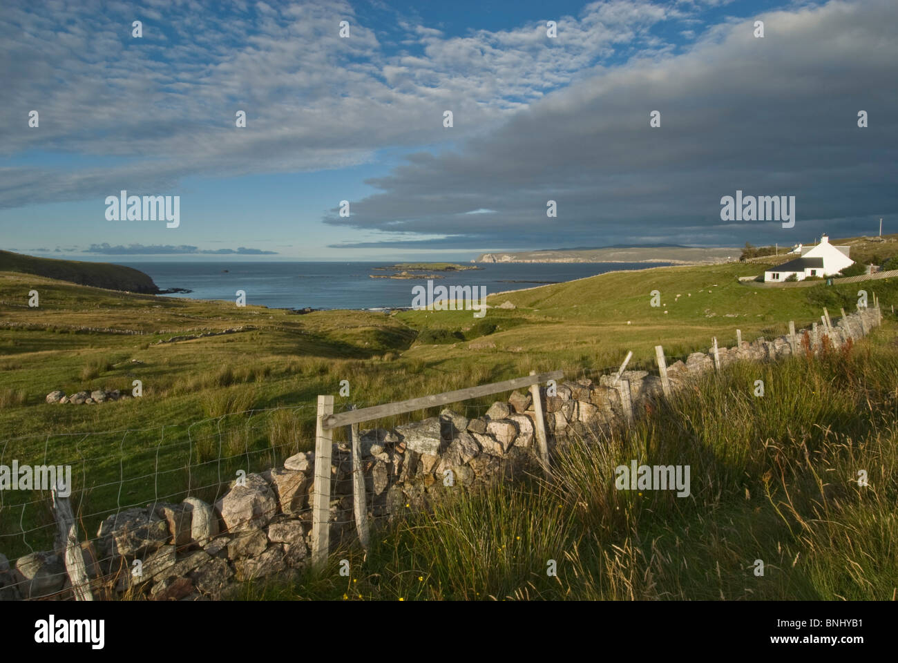 Sea near Durness, Sutherland, Scotland. Old stone wall. Hillside farming near sea. Stock Photo