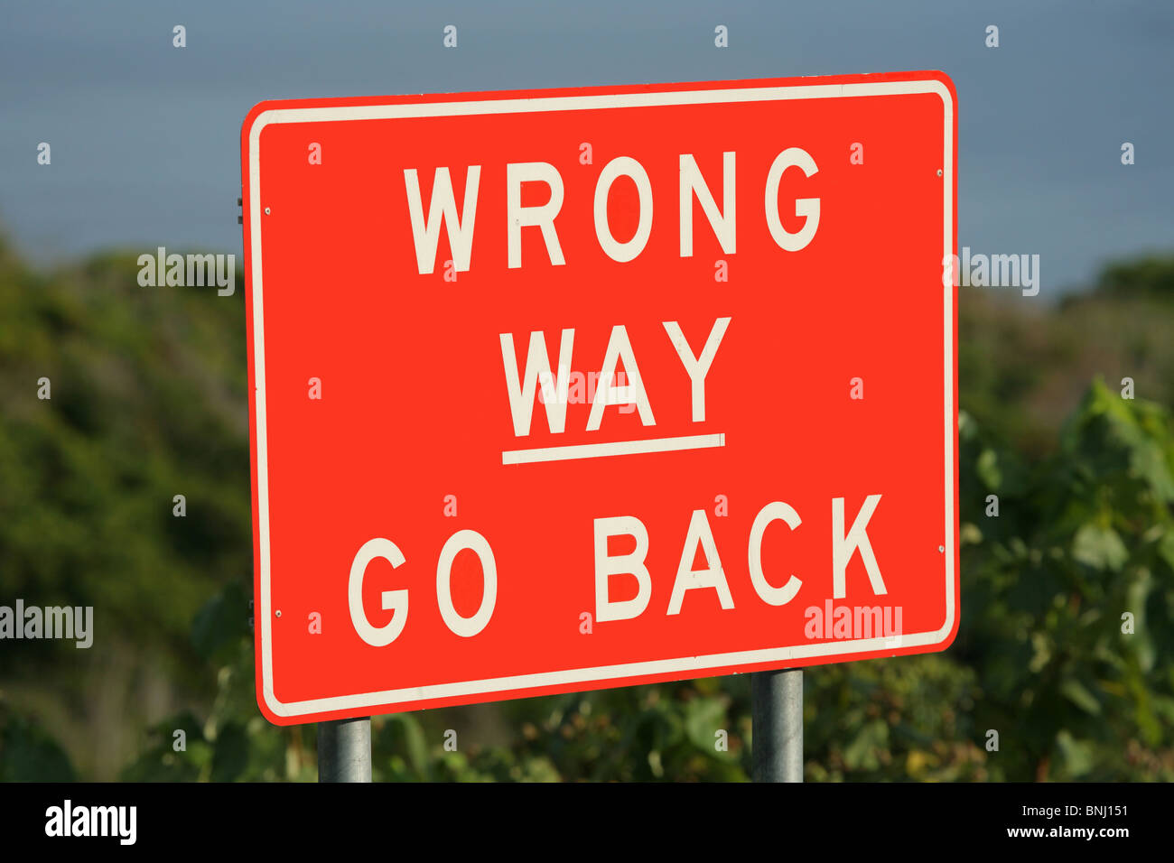 Wrong Way Go Back sign Stock Photo
