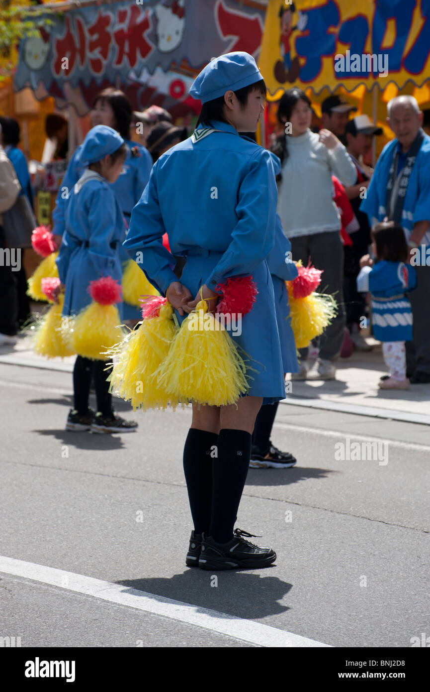 Japanese girl guides preform a dance during Suwa's Onbashira festival. Stock Photo