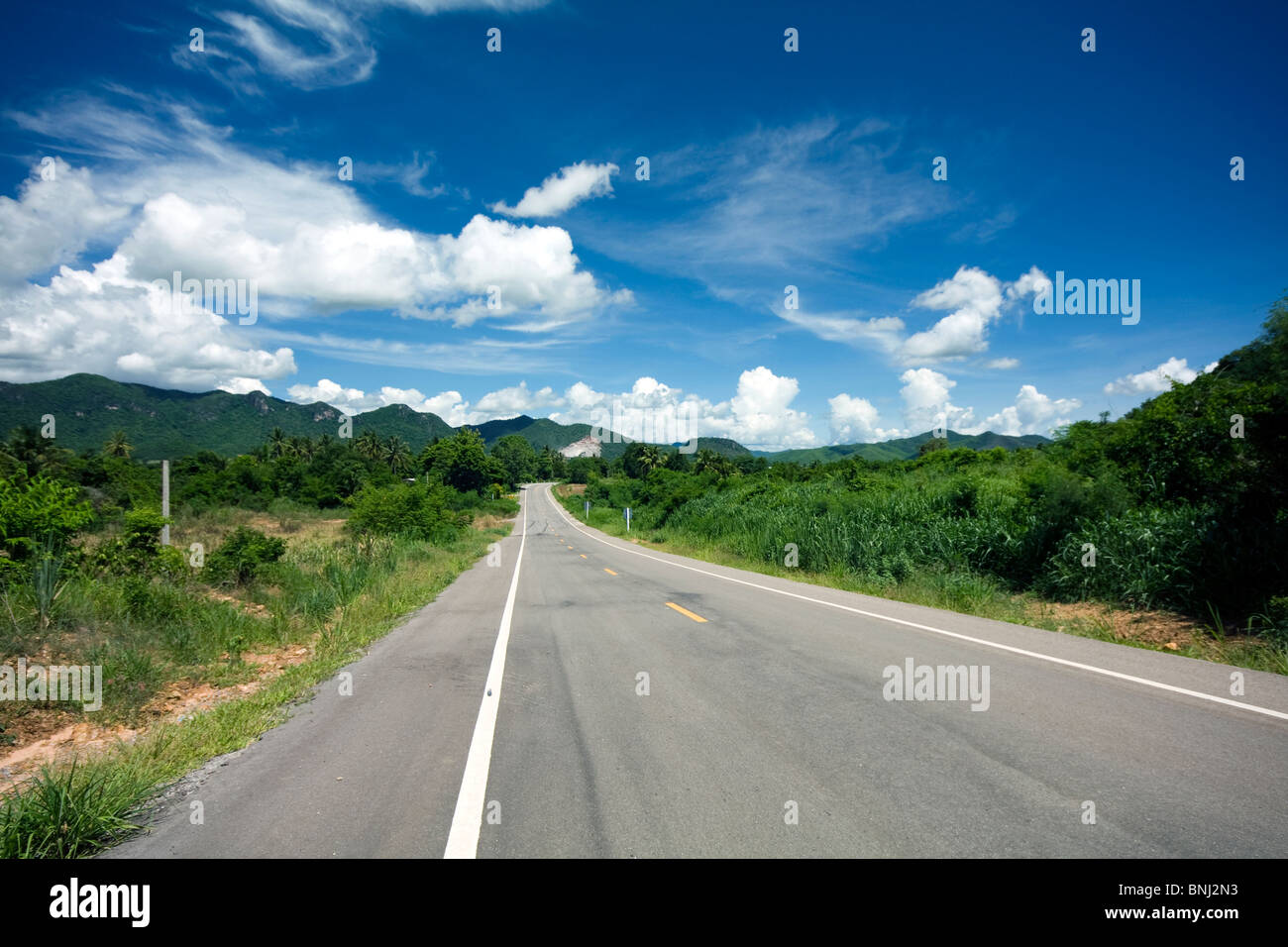 Empty stretch of road into the hills above Hua Hin, Thailand Stock Photo