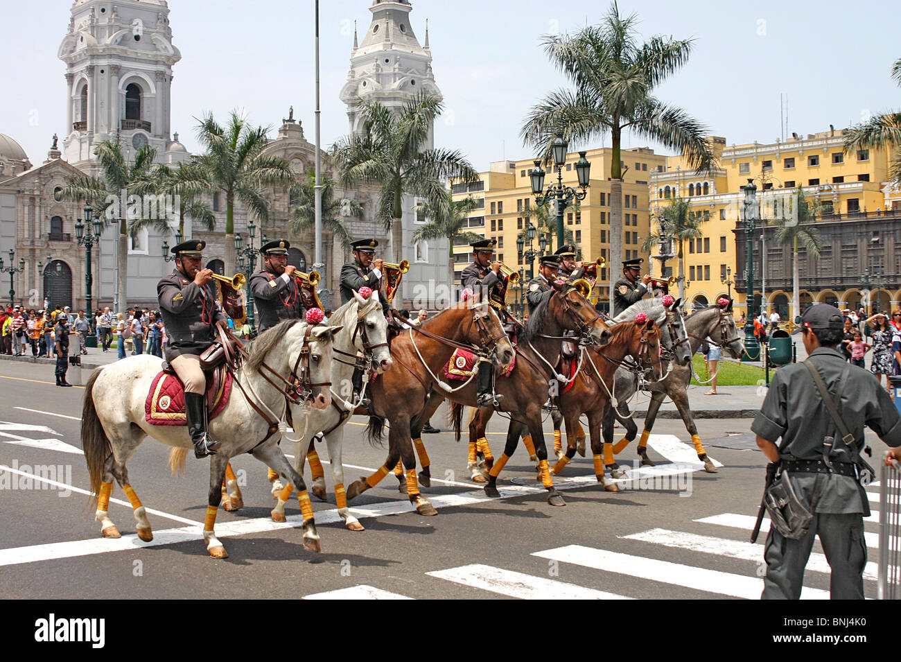 Mounted bugler's ride past the Royal Presidential  Palace at the  daily changing ot the guard in Plaza Mayor,Lima,Mexico. Stock Photo