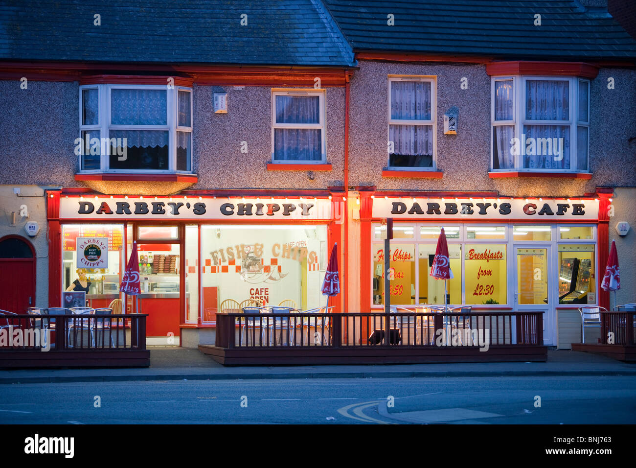 A fish and chip shop in Rhyl, at night, North Wales Stock Photo Alamy