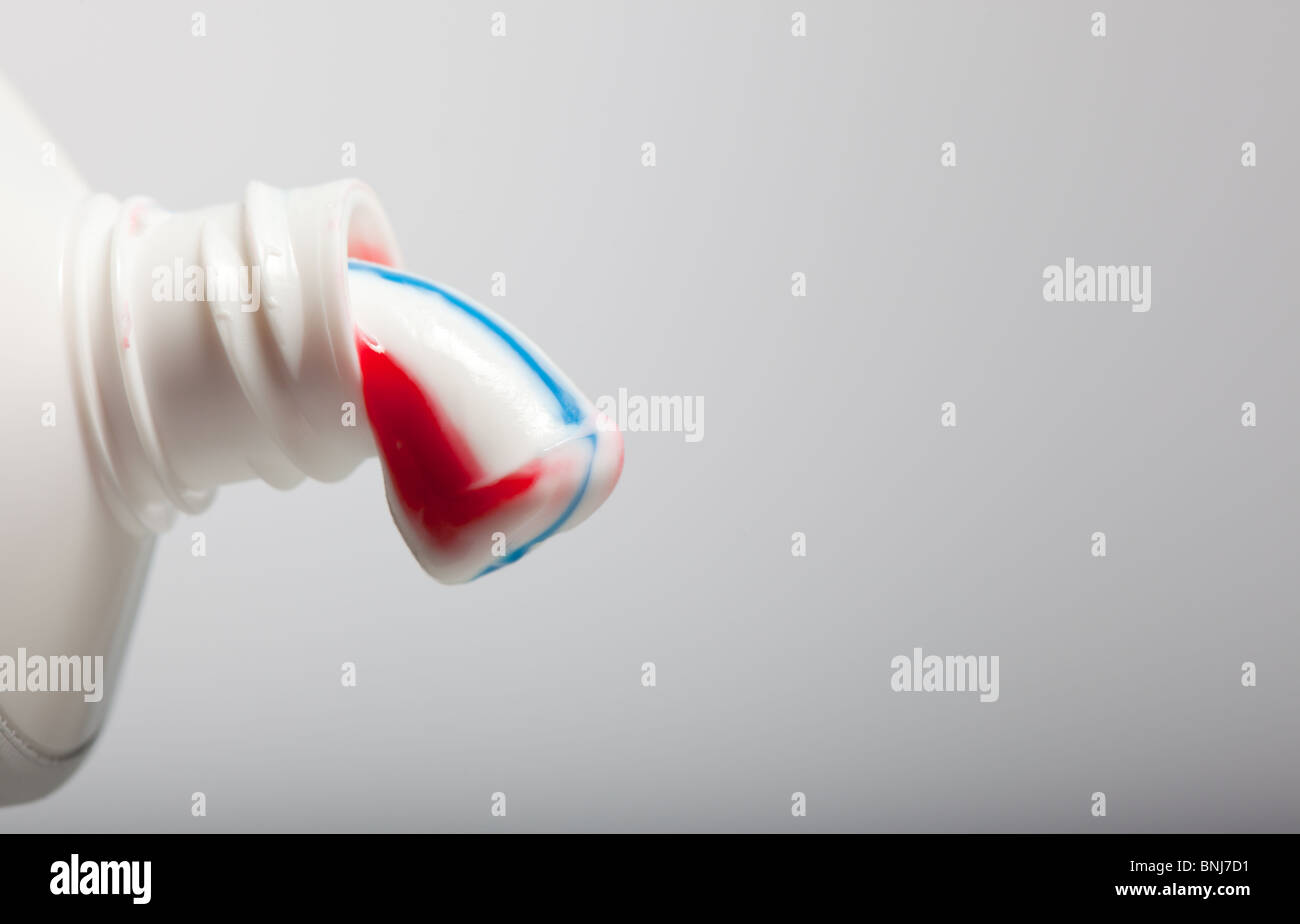 Stripy toothpaste being squeezed out of a tube Stock Photo Alamy