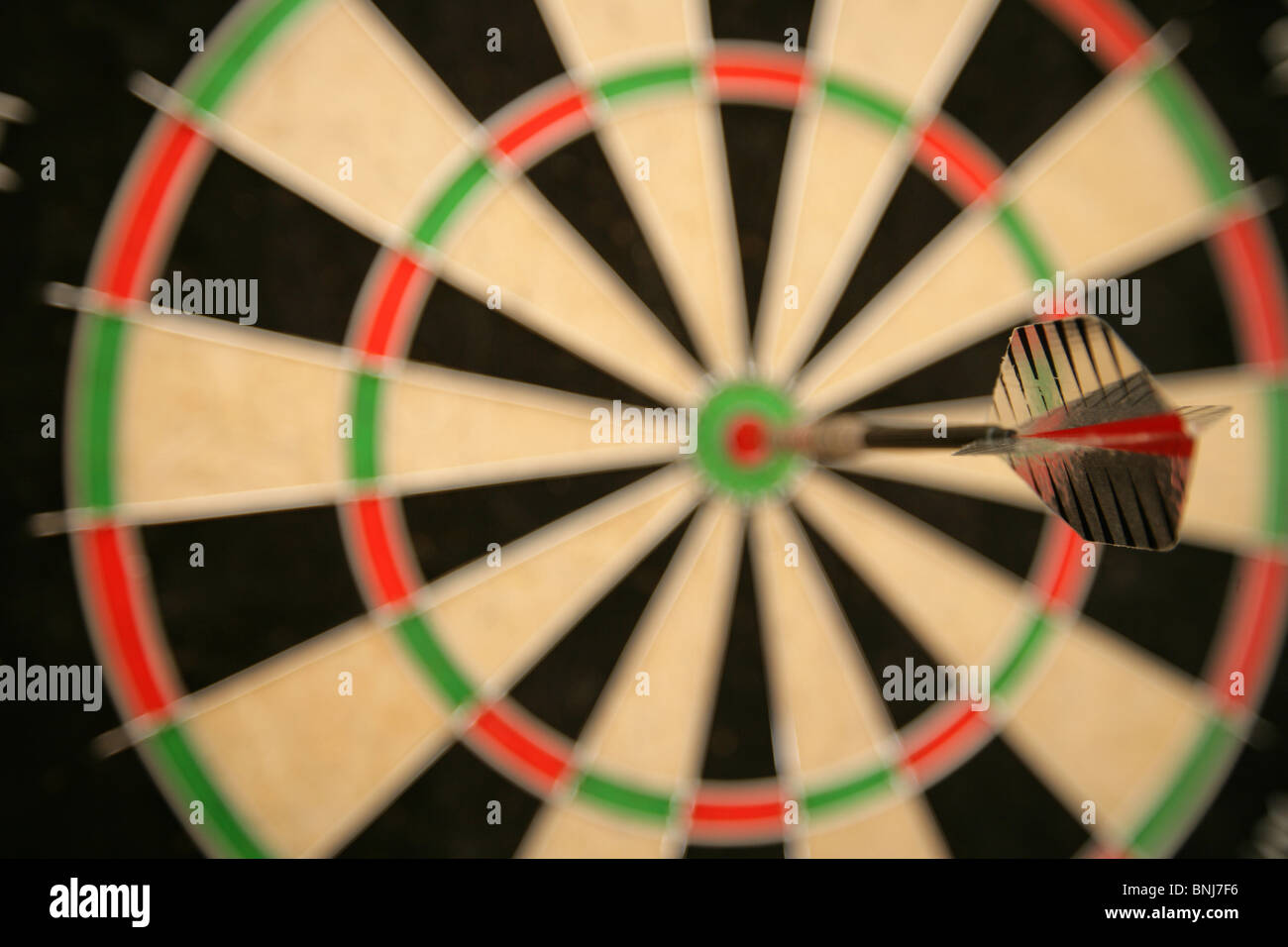 dart in bullseye on dartboard Stock Photo