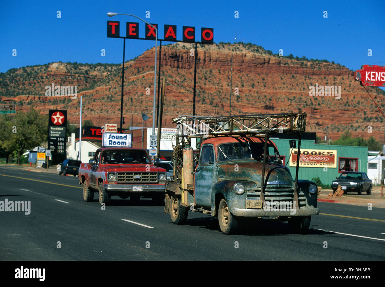 USA Utah town city cars automobiles Classic car gas station Kanab North America United States of America landscape scenery Stock Photo