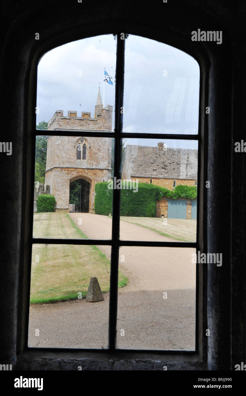The gatehouse viewed from the main hall at Broughton Castle near Banbury in Oxfordshire UK Stock Photo