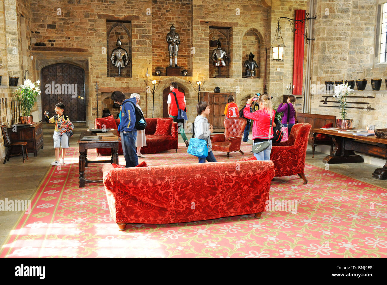 Visitors explore the halls and historic civil war displays at Broughton Castle near Banbury in Oxfordshire UK Stock Photo