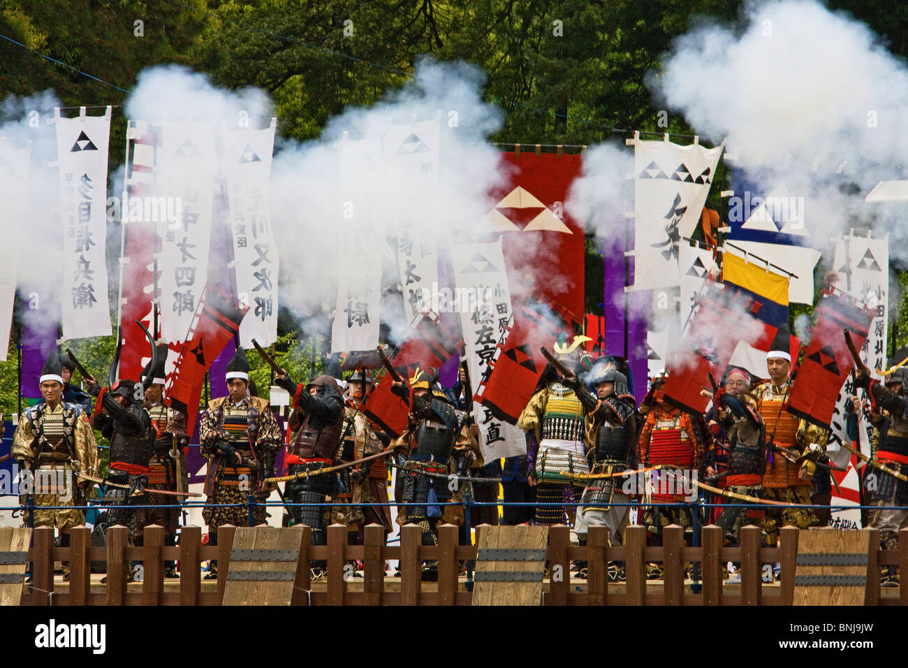 Japan Asia Odawara castle castle festival men national costumes costumes custom flags shooting powder smoke Stock Photo