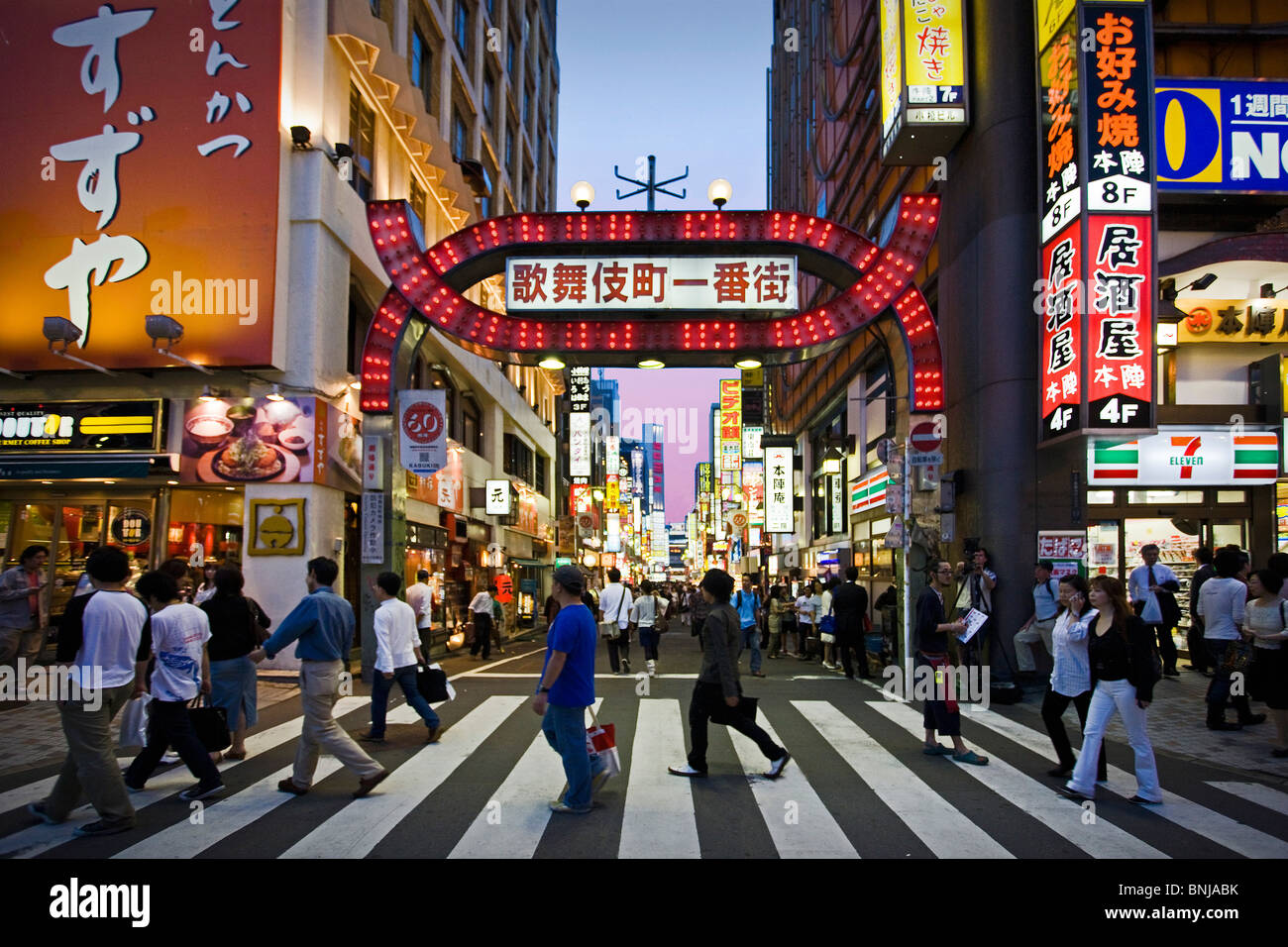 Japan Asia Tokyo town city Shinjuku East Side Kabukicho entertainment District shops dealings neon lights passers-by Stock Photo