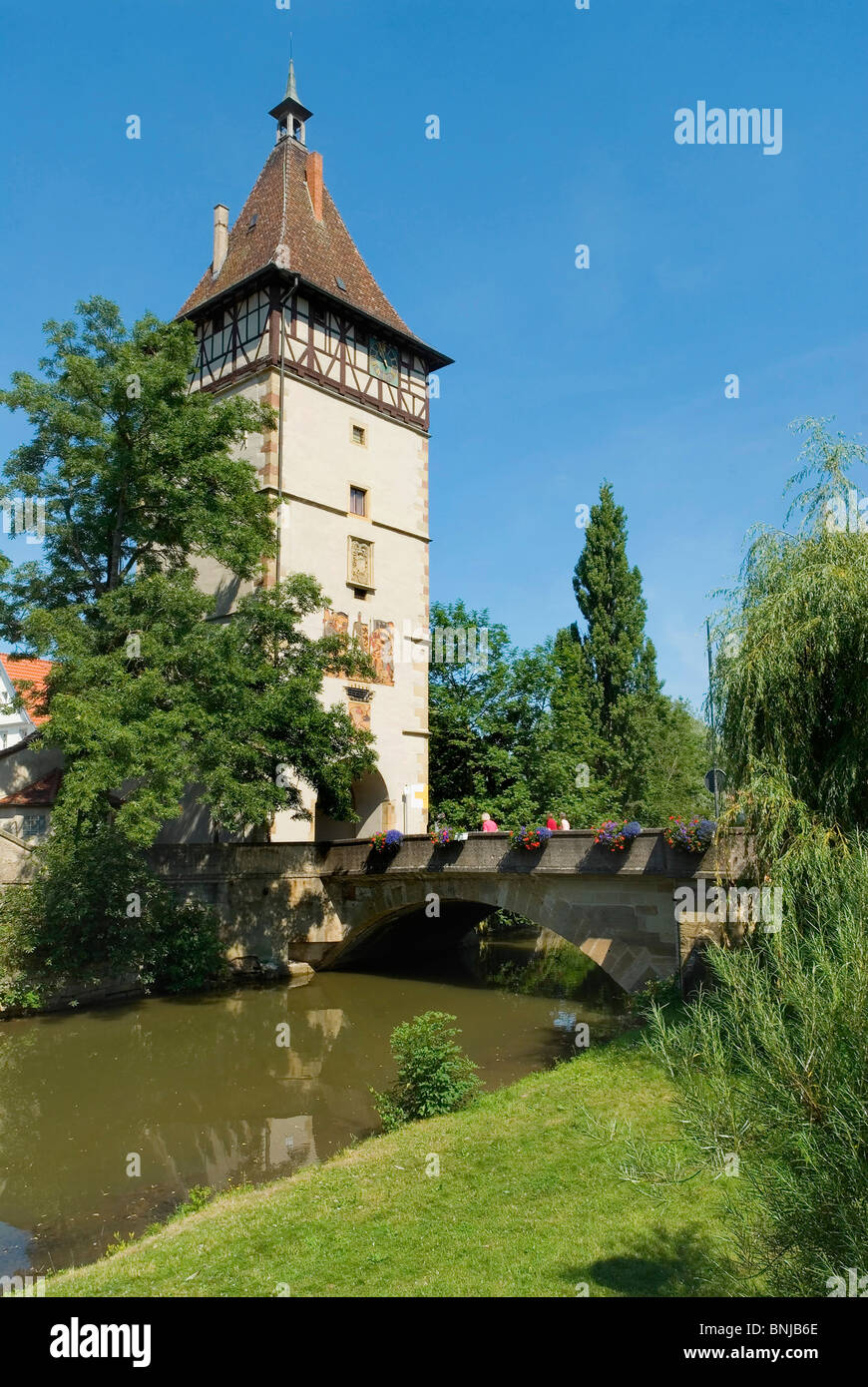 Germany Baden-Wurttemberg Waiblingen Beinsteiner gate town tower way through town gate trees framework river flow Rems river Stock Photo
