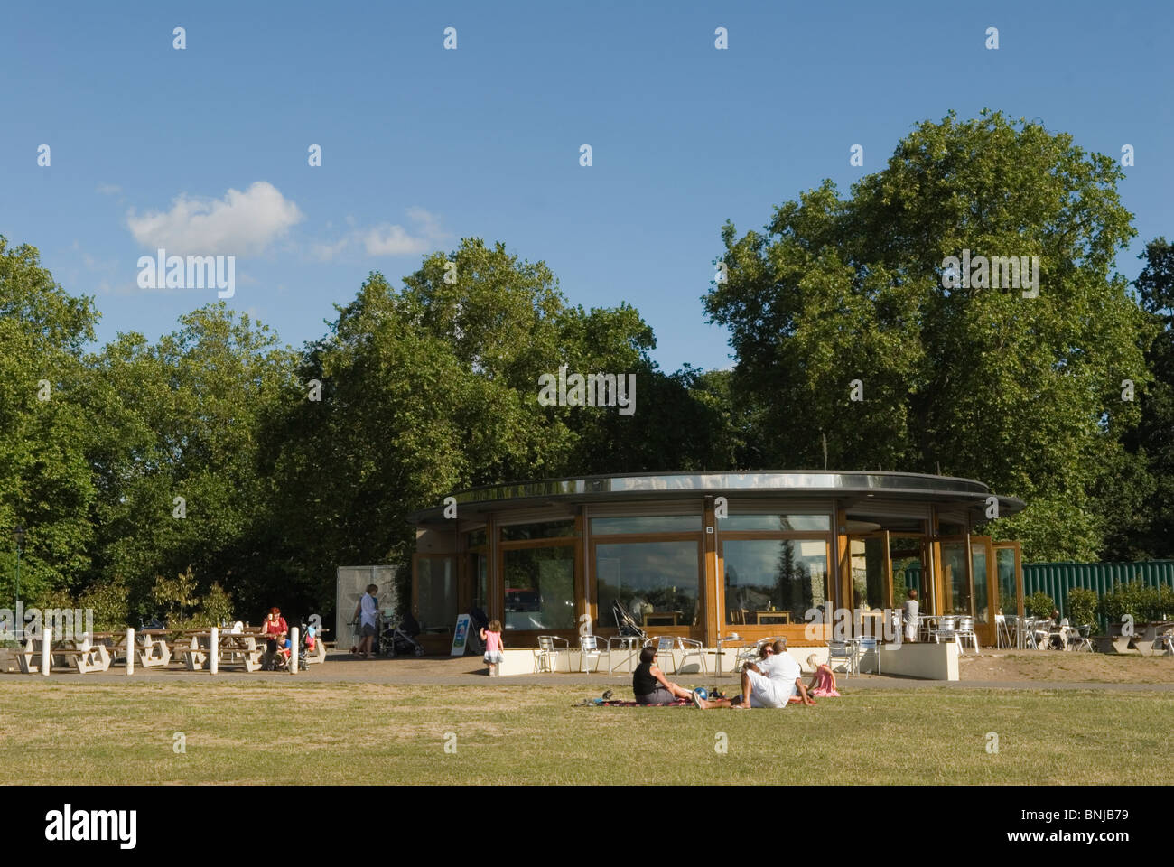 South London Peckham Rye Park and cafe groups of local people siting outside on the grass, summer in London. 2010, 2010s UK Stock Photo