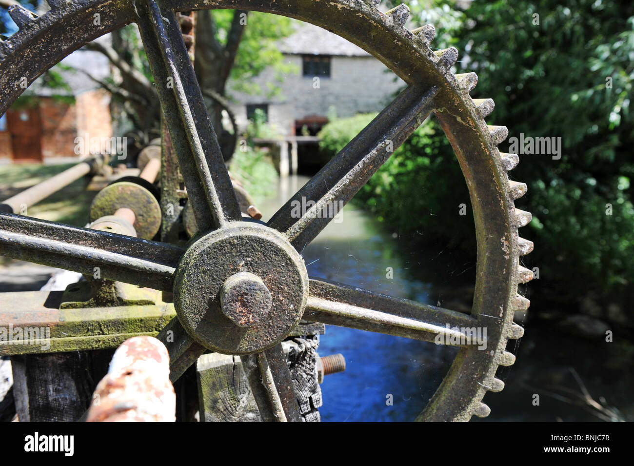 Cogg wheel on weir control at Crawley Mill Industrial Estate, Dry Lane, Crawley, Witney Oxfordshire UK OX29 Stock Photo