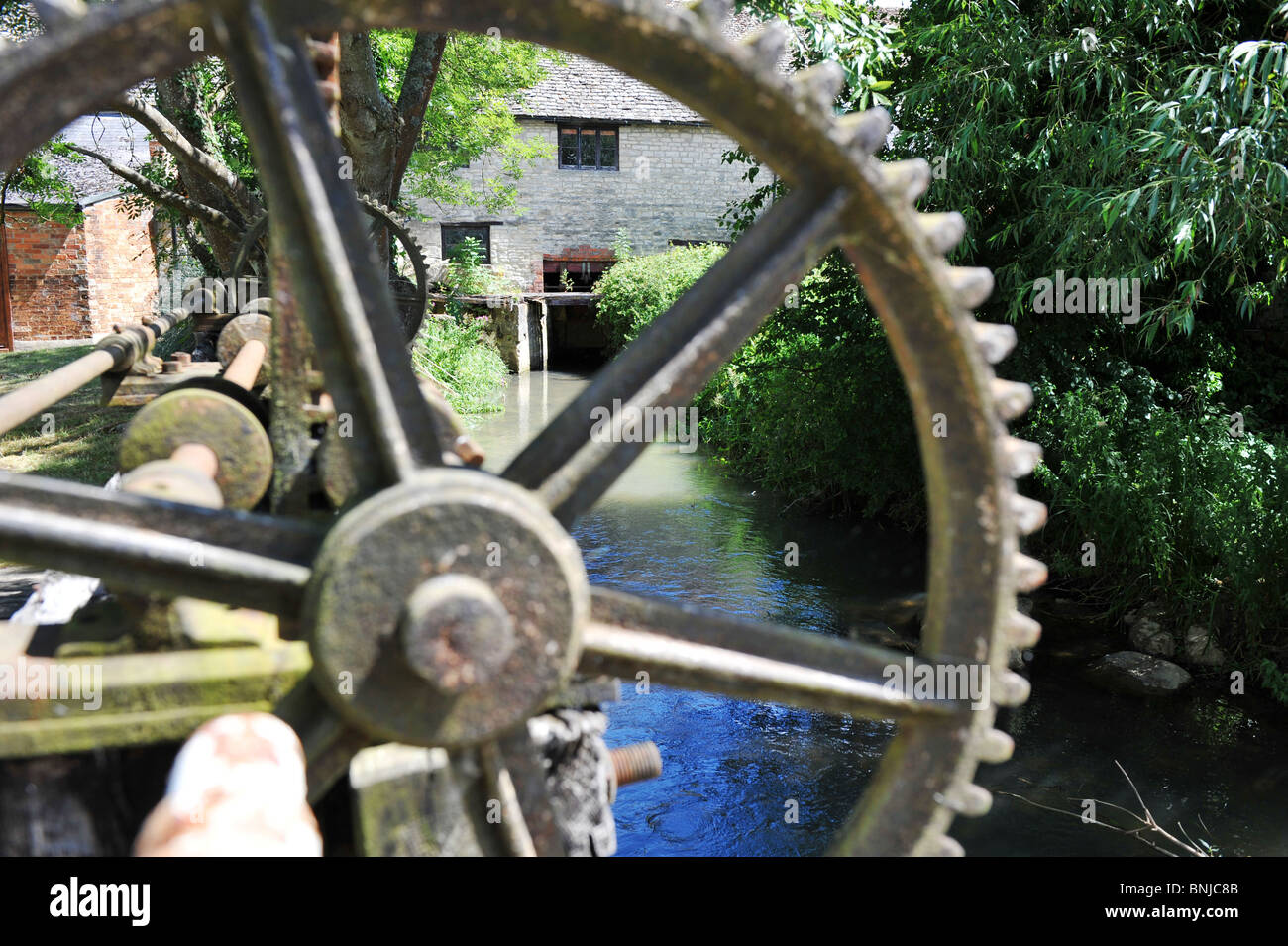 Cogg wheel on weir control at Crawley Mill Industrial Estate, Dry Lane, Crawley, Witney Oxfordshire UK OX29 Stock Photo