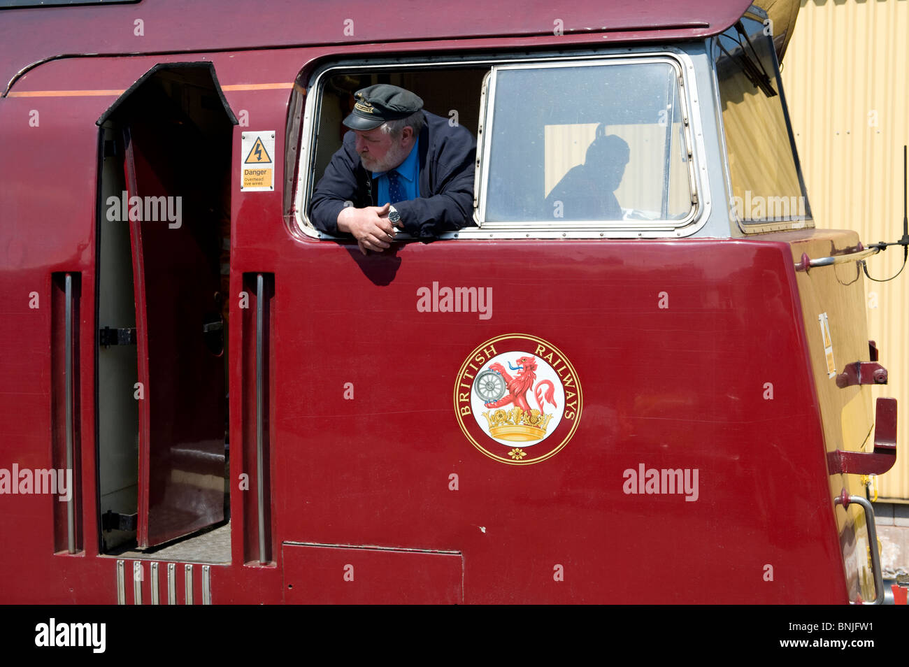 The driver of the preserved 'Western' class diesel locomotive on the West Somerset Railway, Minehead, Devon, UK Stock Photo