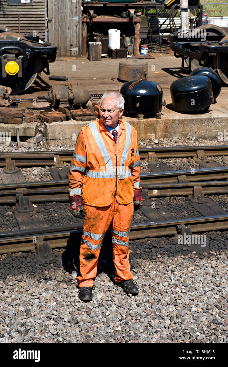 A railway worker on the West Somerset Railway at Minehead, UK Stock Photo