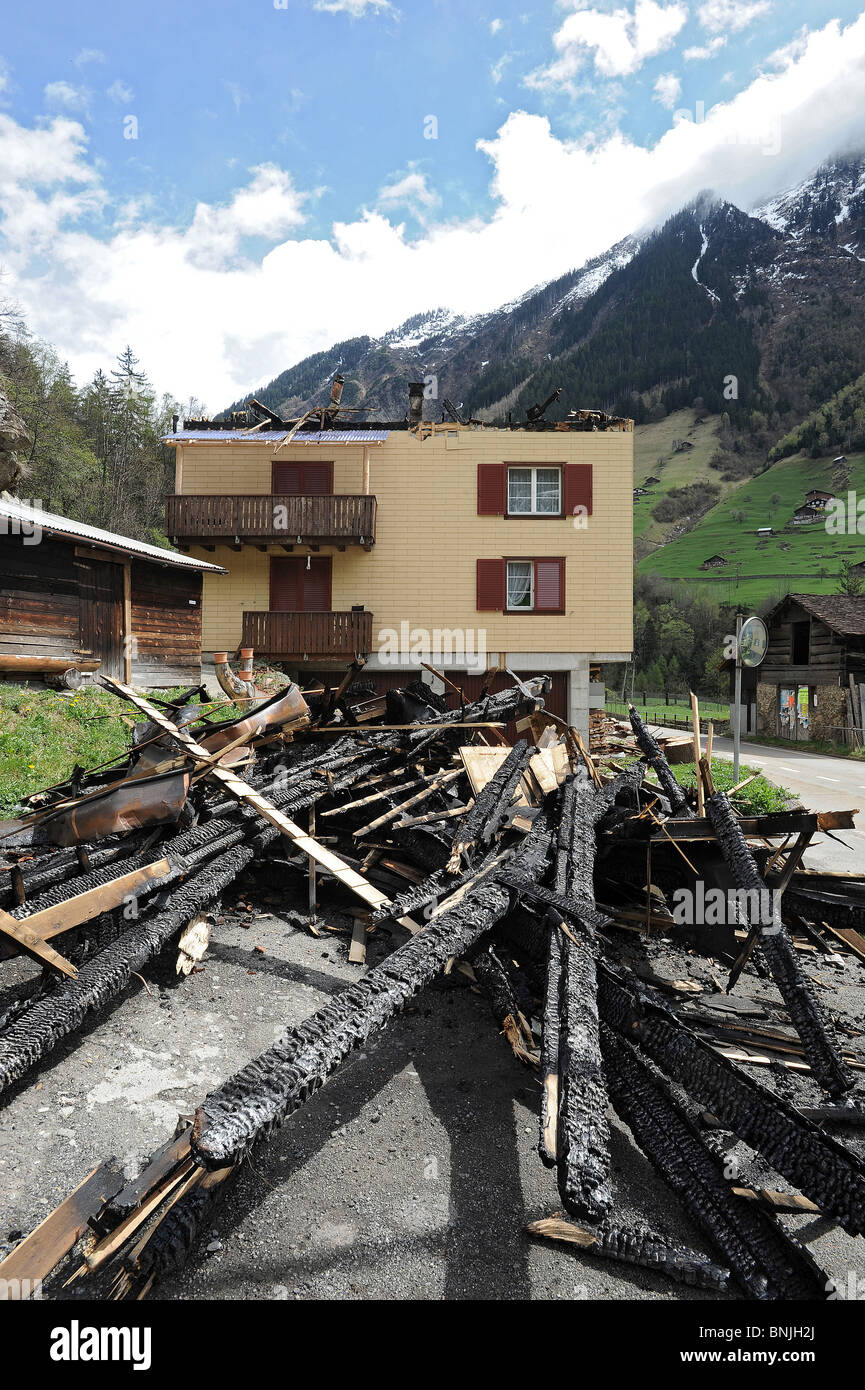 Switzerland Canton of Uri Wassen House Building Burnt down Fire Charred Wood Wooden beams Insurance Damage Destruction Burned Stock Photo