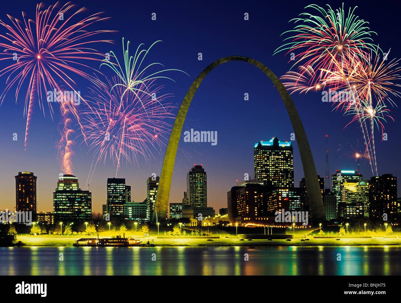 Beautiful fireworks fill the night time sky of St. Louis Skyline