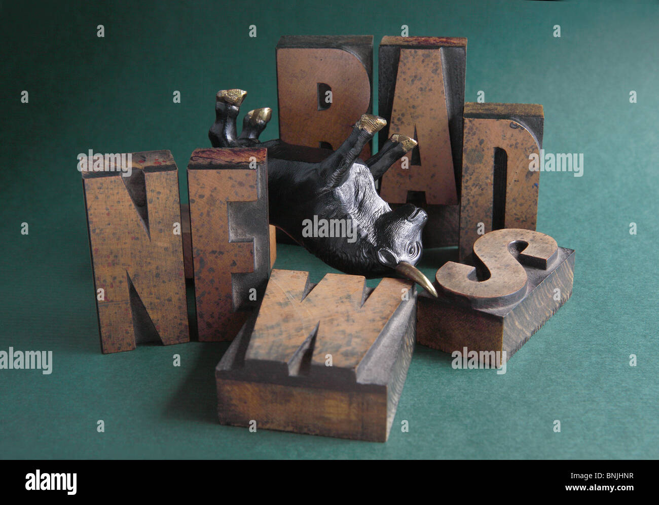 figure of a bull upside down with the words bad news around it Stock Photo