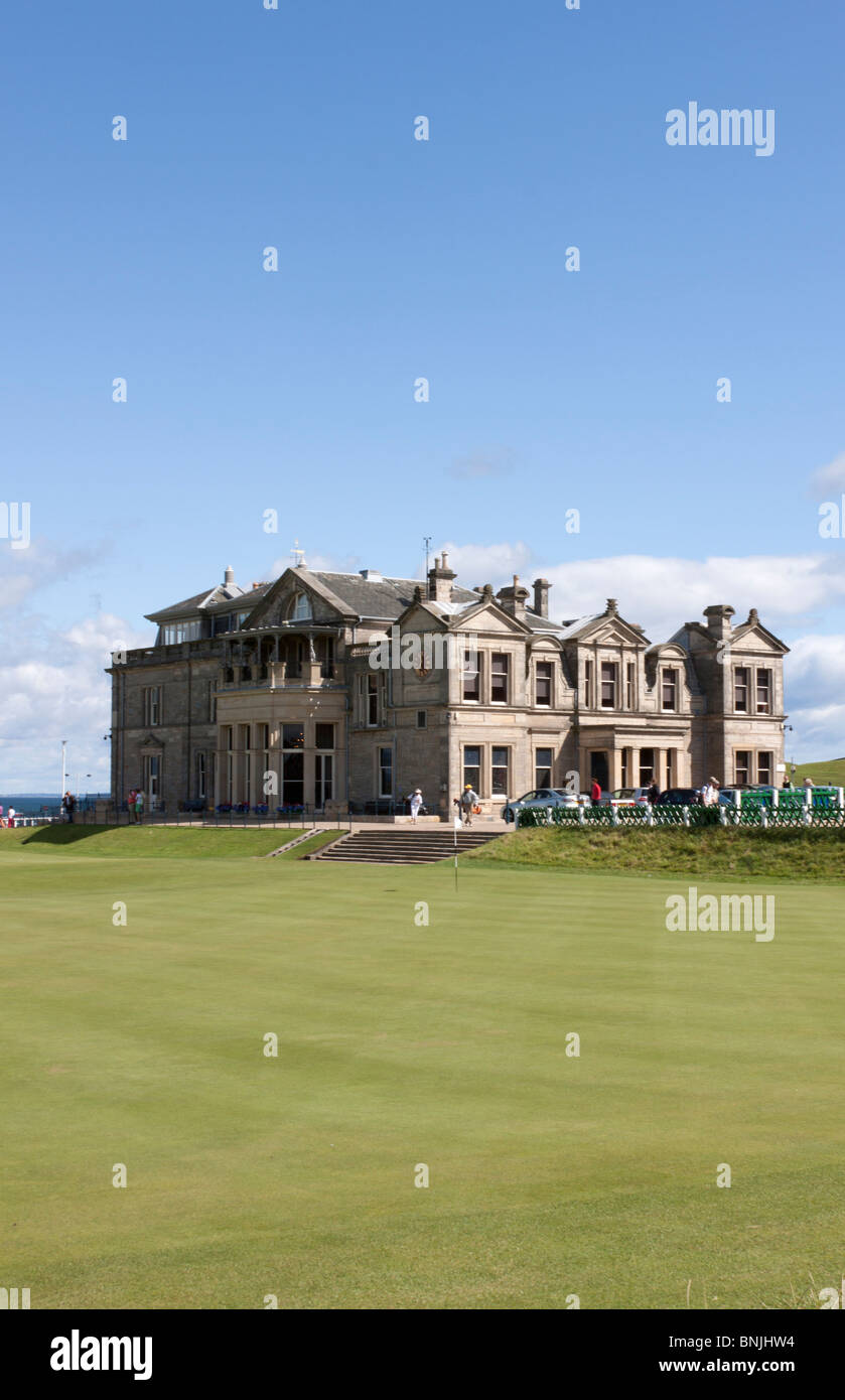 The clubhouse of The Famous Royal And Ancient Golf Course, St Andrews, Scotland, with the 18th green in the foreground. Stock Photo