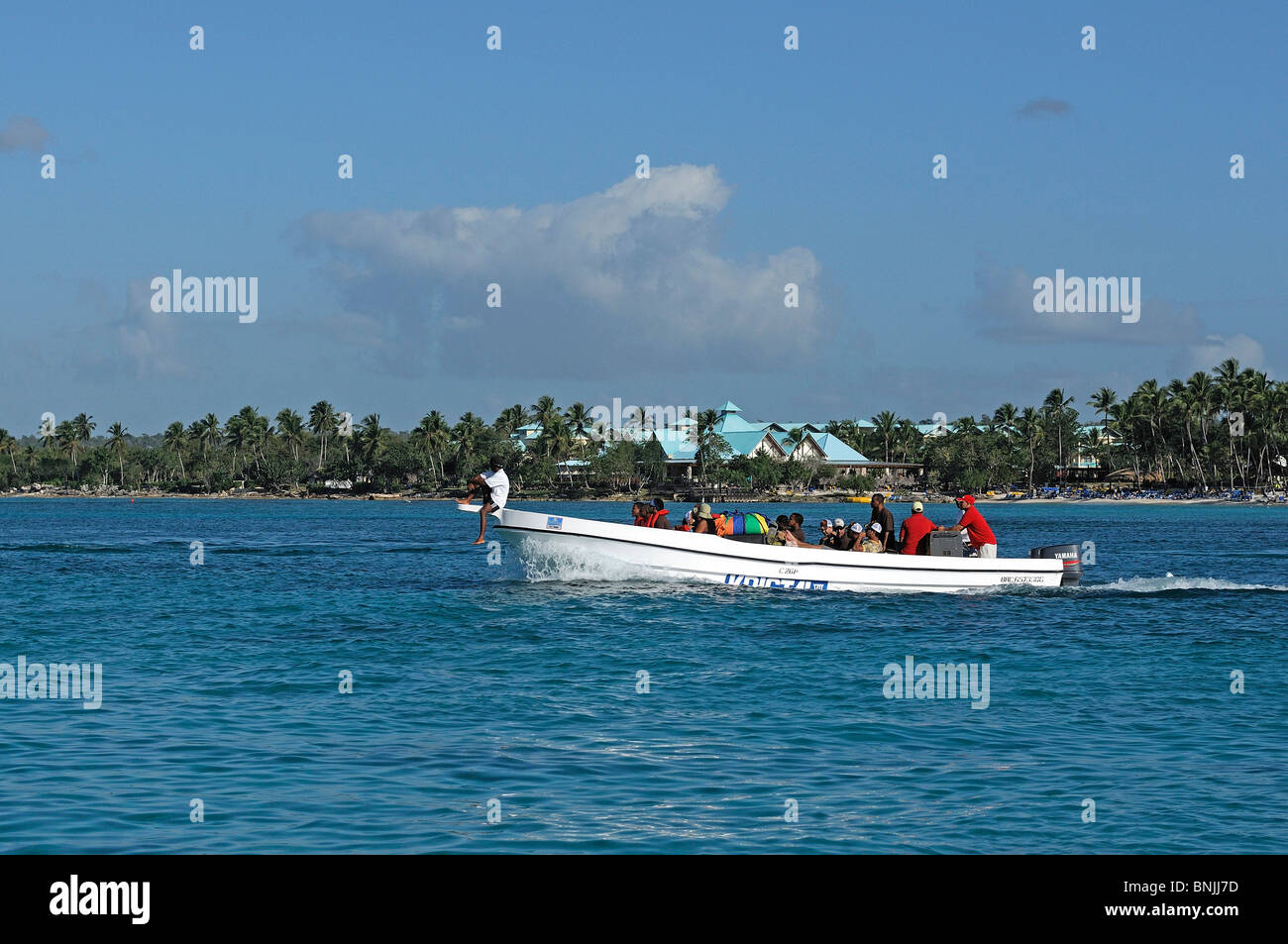 Boat Bayahibe La Romana Dominican Republic palm trees beach travel tourism holiday Caribbean Stock Photo
